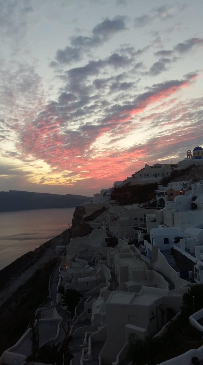 Oia at sunset on the Santorini caldera rim